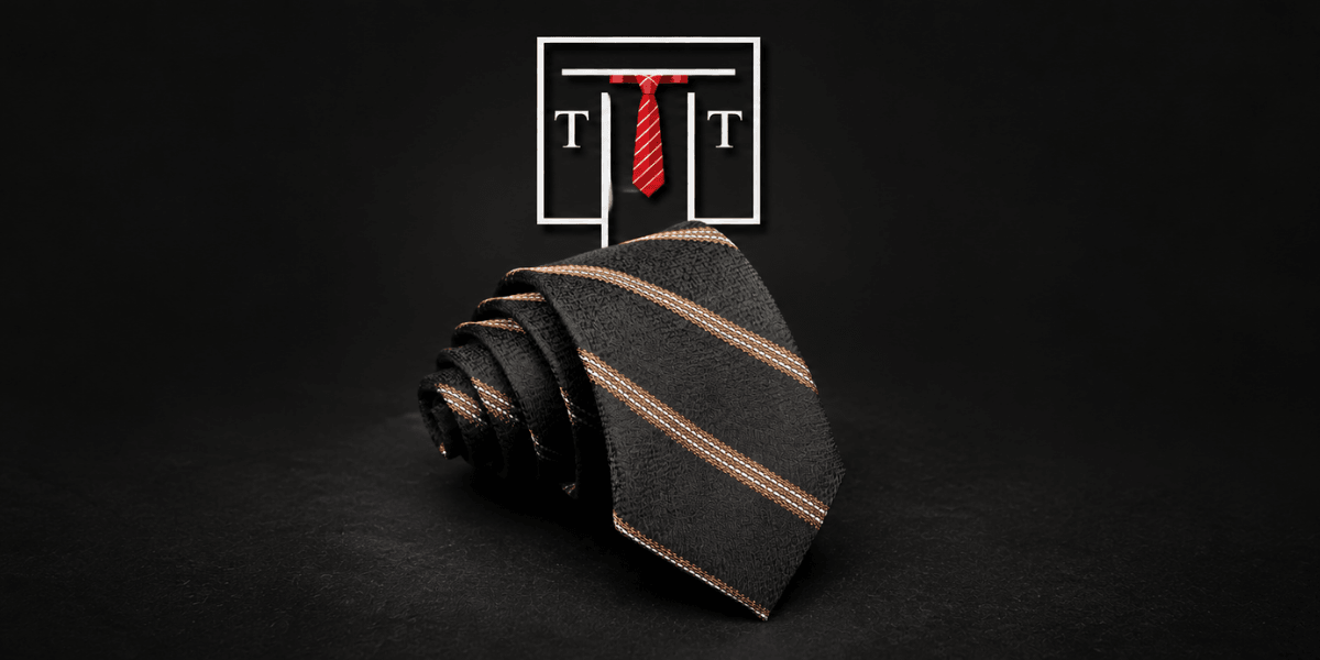Black necktie folded neatly with orange stripes on a dark background and logo above
