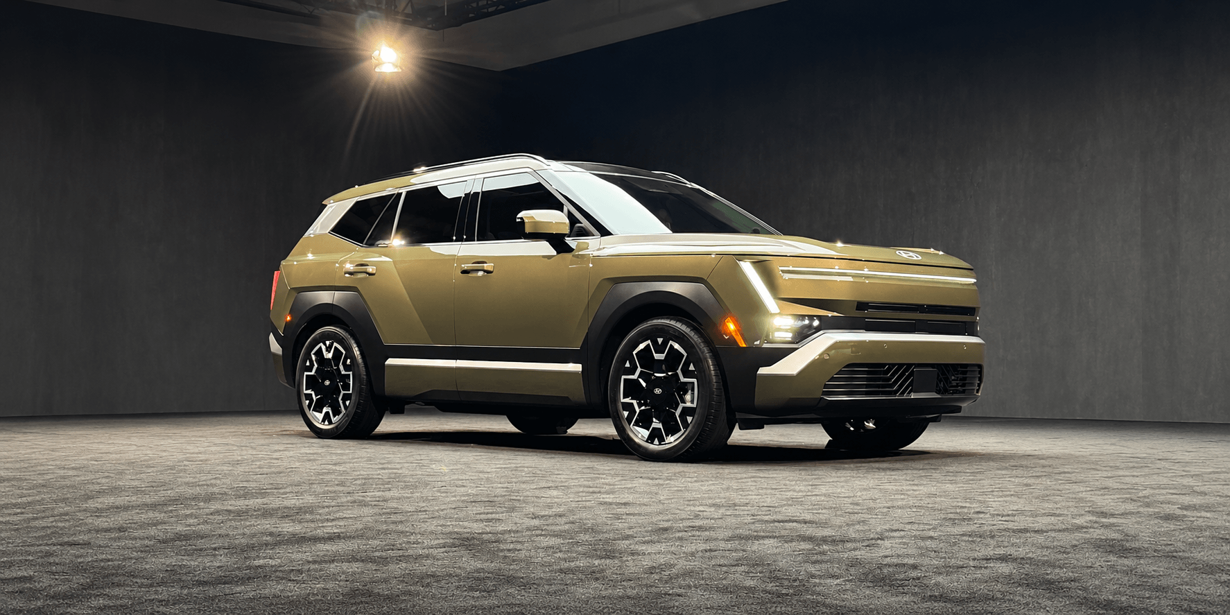 A modern SUV with a unique design, showcased in a well-lit studio setting