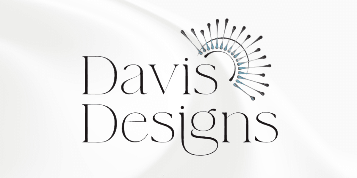 Logo for Davis Designs featuring elegant typography and artistic circular elements