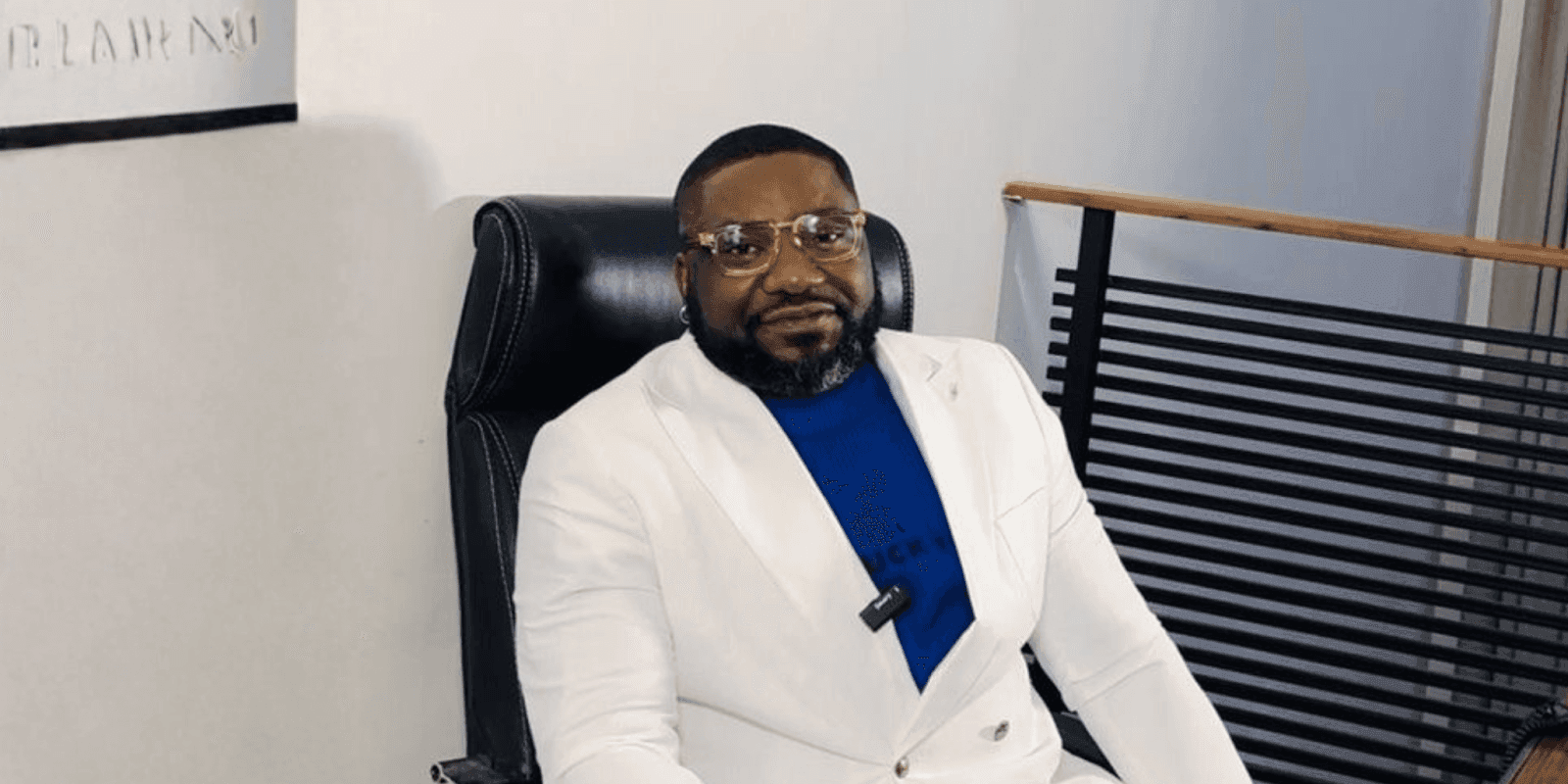 "Jephthah Abanum, founder of RendezvousCare, seated in a professional setting, embodying his mission to empower through personal growth and wellness."