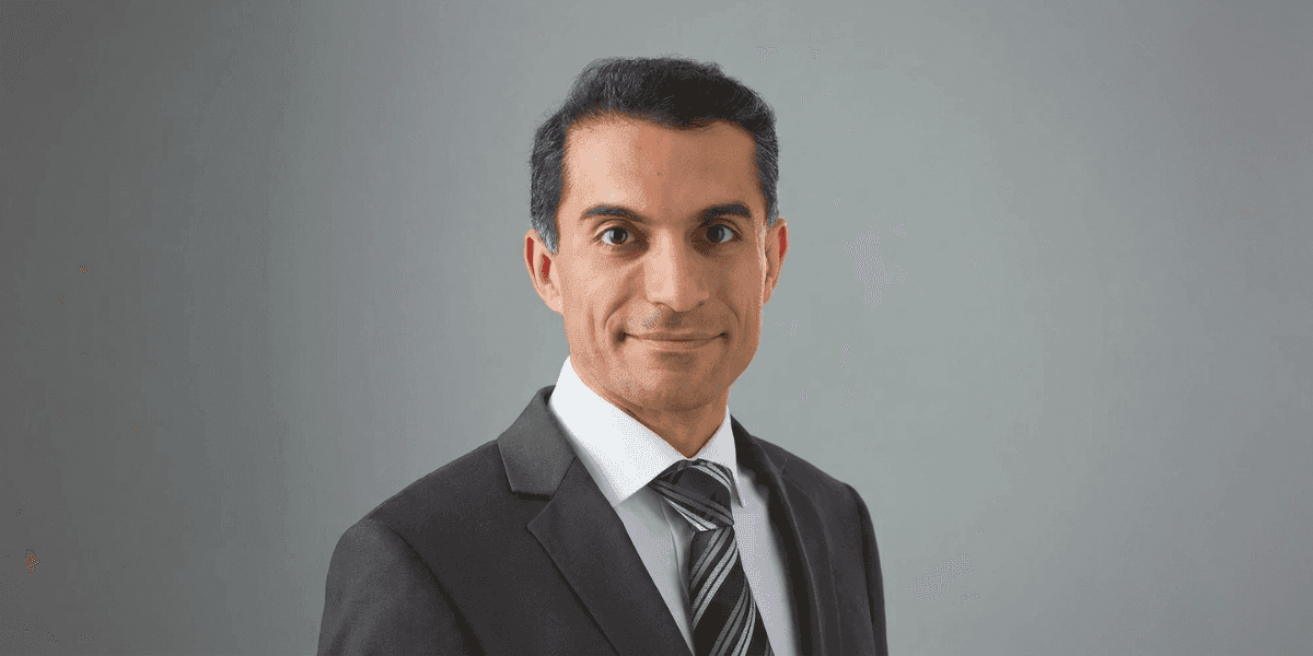 Professional portrait of Dr. Mahyar Amjadi in a suit and tie.