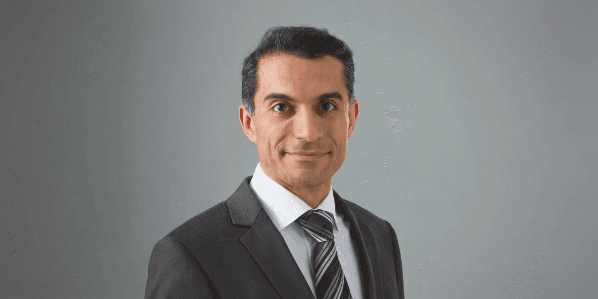 Professional portrait of Dr. Mahyar Amjadi in a suit and tie.