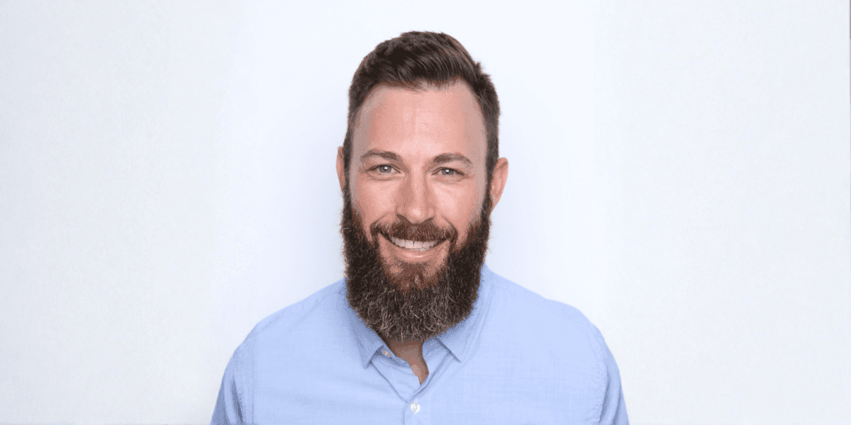 "Justin Currie, CEO of Masters of Home Care, smiling confidently, representing leadership, mentorship, and scalable home care business success."
