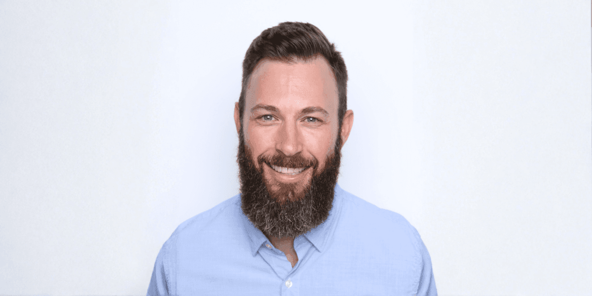 "Justin Currie, CEO of Masters of Home Care, smiling confidently, representing leadership, mentorship, and scalable home care business success."