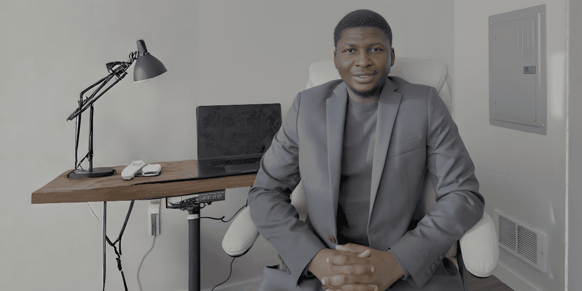 Joseph Oladokun, Data Scientist, in a professional setting, discussing AI reliability, with a laptop and desk in background.
