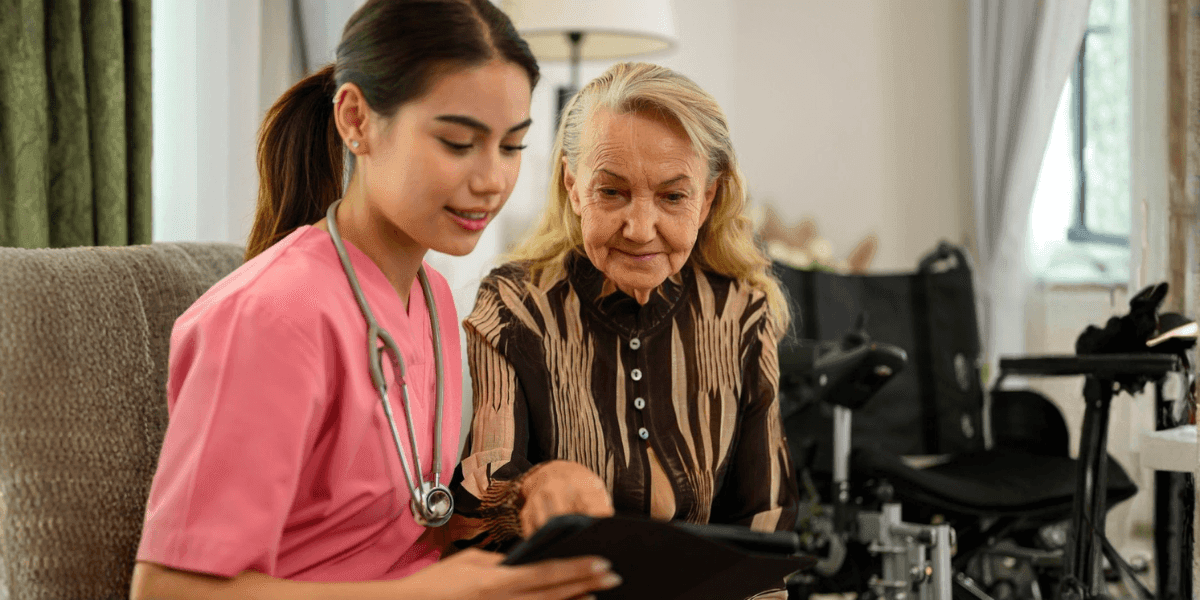 A caregiver assisting an elderly woman, highlighting the importance of skilled nursing in managing Alzheimer's care at home.