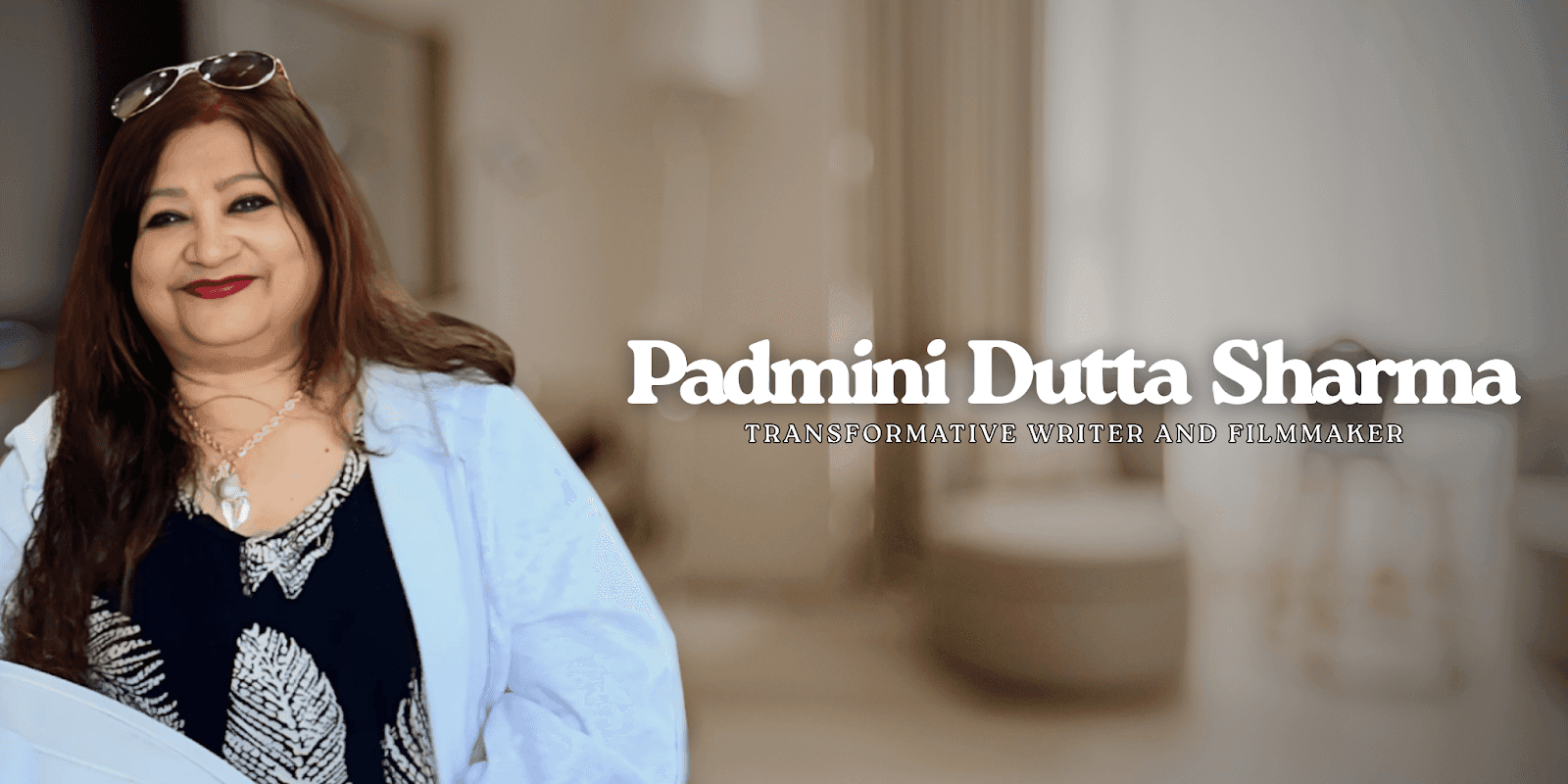 Padmini Dutta Sharma, smiling, with text overlay: "Transformative Writer and Filmmaker" on blurred indoor background.