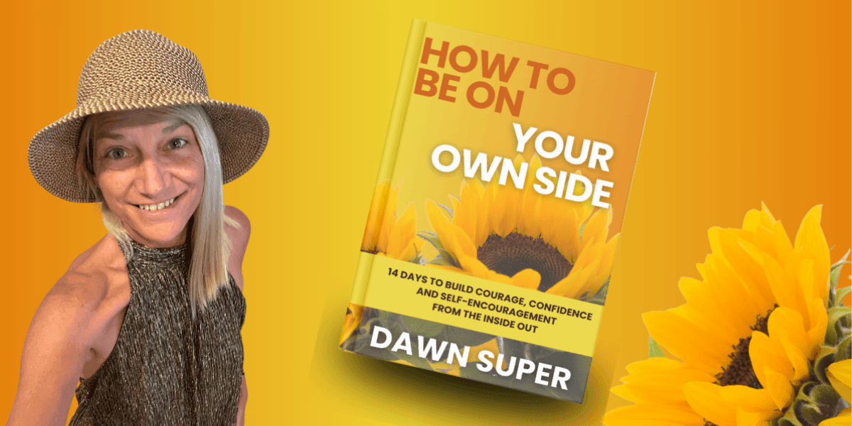 Author Dawn Super smiling with her book How to Be on Your Own Side, a guide to self-empowerment.