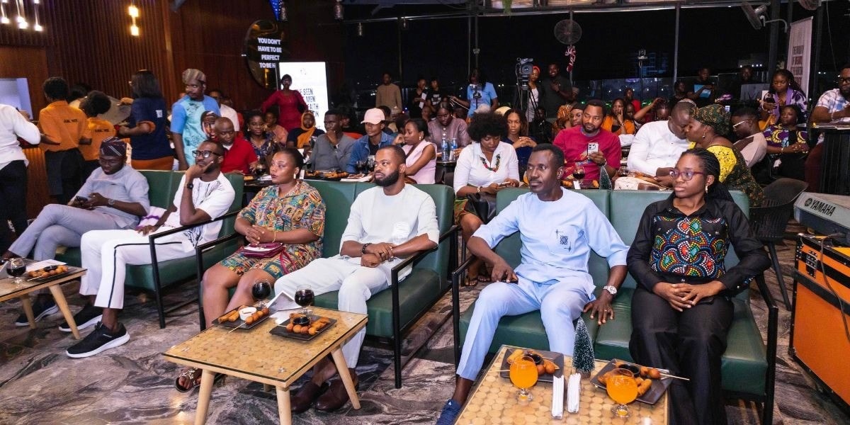 "Vic'Adex's theatrical poetry launch event in Abuja, featuring diverse attendees celebrating his impactful literary work and performances."