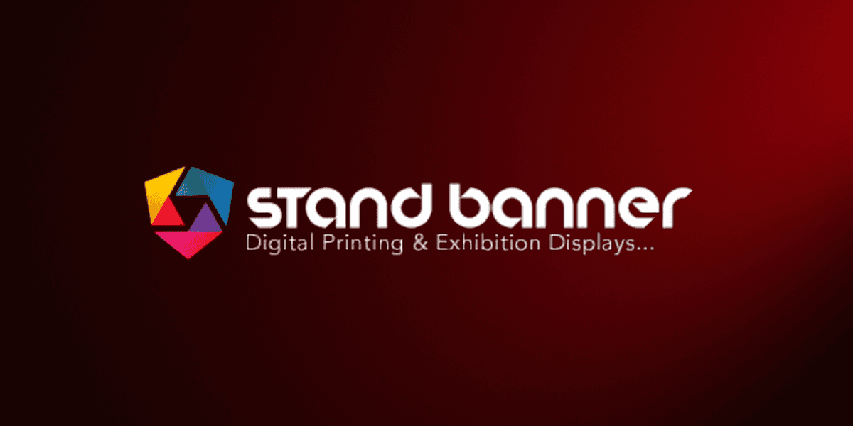 Logo for "Stand Banner" set against a red gradient background. Features a colorful geometric emblem on the left and white text stating “Digital Printing & Exhibition Displays.”
