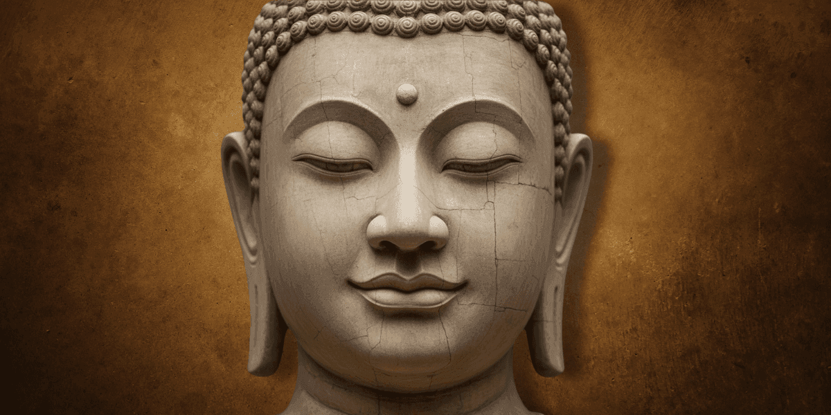 Close-up of a Buddha statue with closed eyes against a textured brown background.