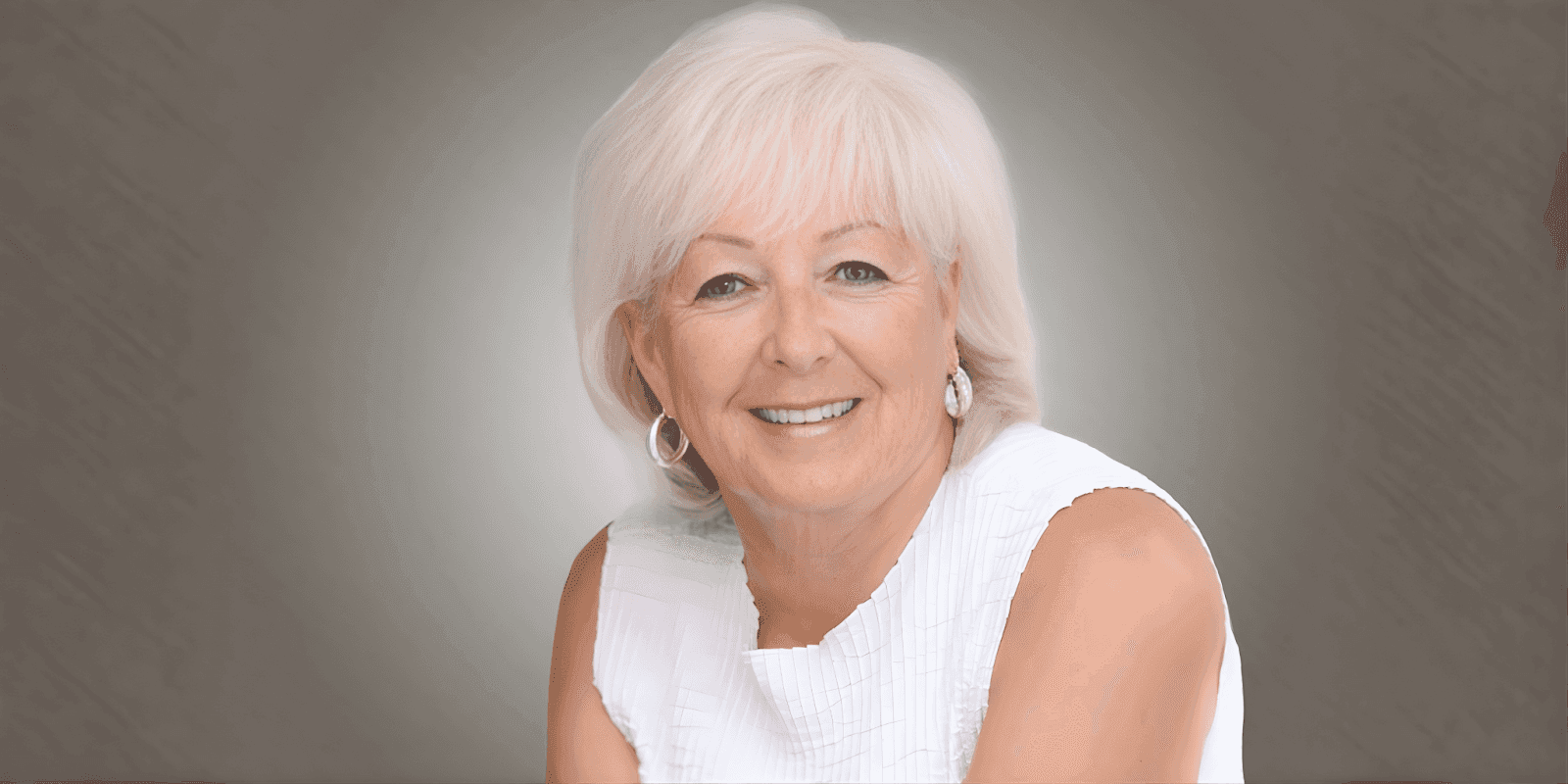 "Patricia Sands, bestselling author of women’s fiction, smiling while holding her book, exemplifying resilience, empowerment, and second chances in life."