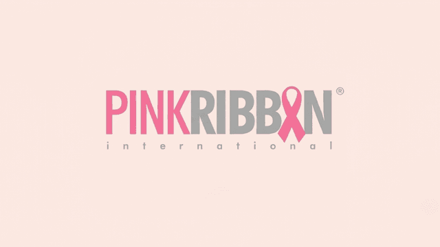 Logo of Pink Ribbon International featuring pink and gray text with a ribbon symbol