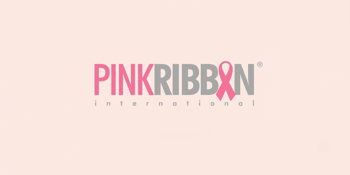 Logo of Pink Ribbon International featuring pink and gray text with a ribbon symbol