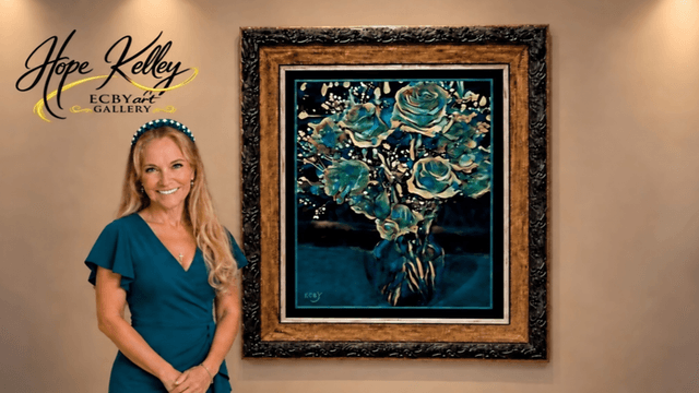 A woman stands beside a framed floral painting in an art gallery setting