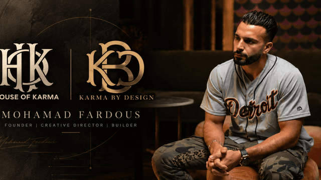 Man seated in a stylish environment with branding for House of Karma and Karma by Design