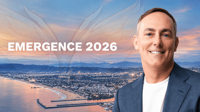 Man smiling in front of a coastal cityscape with "EMERGENCE 2026" text overlay