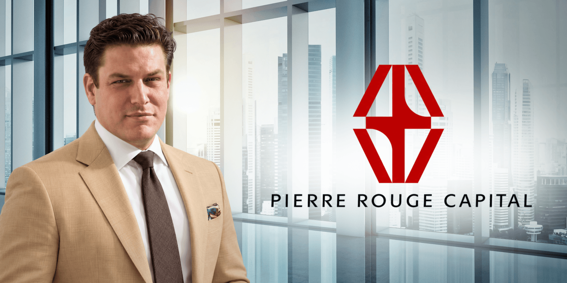 A professionally dressed man poses in an office setting with a capital firm logo