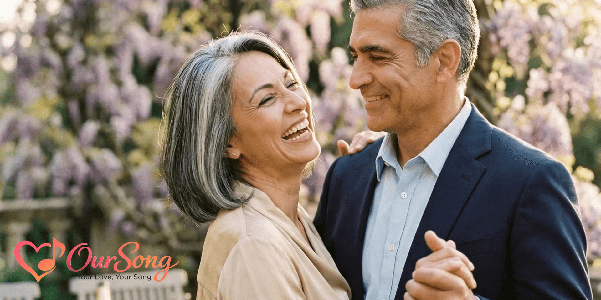 A happy couple dancing together outdoors, surrounded by blooming flowers and greenery