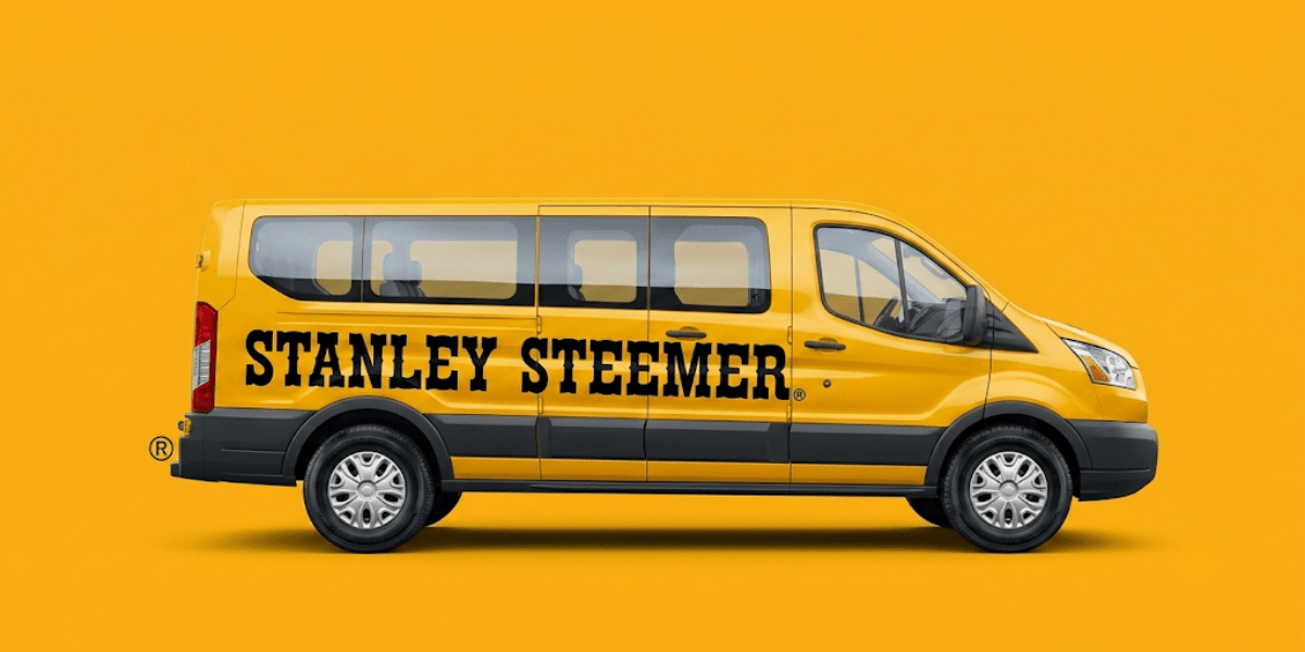 A yellow van with "STANLEY STEEMER" boldly displayed on the side.