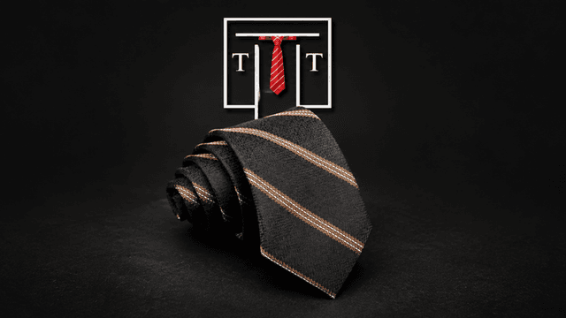 Black necktie folded neatly with orange stripes on a dark background and logo above