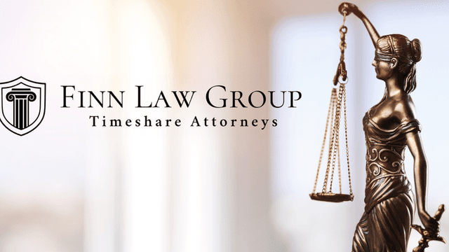 Logo of Finn Law Group with a bronze statue of Lady Justice holding scales