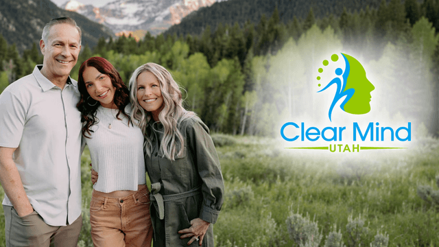 Three people smiling together outdoors with a mountain landscape and a logo overlay