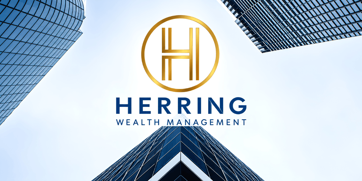 Modern skyscrapers with Herring Wealth Management logo in the foreground against a blue sky