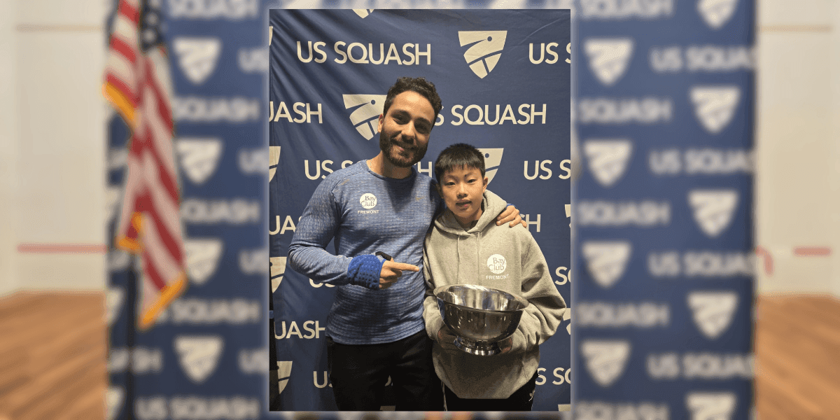 Omar Elhadidi, a Level 3 certified squash coach, poses with a young player at a US Squash event. Elhadidi, known for transforming squash training in the Bay Area, brings Egyptian coaching expertise to California, helping players achieve top national rankings and prepare for the 2028 Olympics.