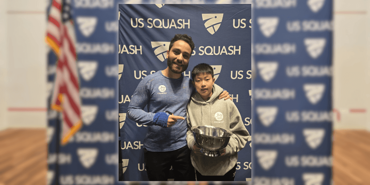 Omar Elhadidi, a Level 3 certified squash coach, poses with a young player at a US Squash event. Elhadidi, known for transforming squash training in the Bay Area, brings Egyptian coaching expertise to California, helping players achieve top national rankings and prepare for the 2028 Olympics.