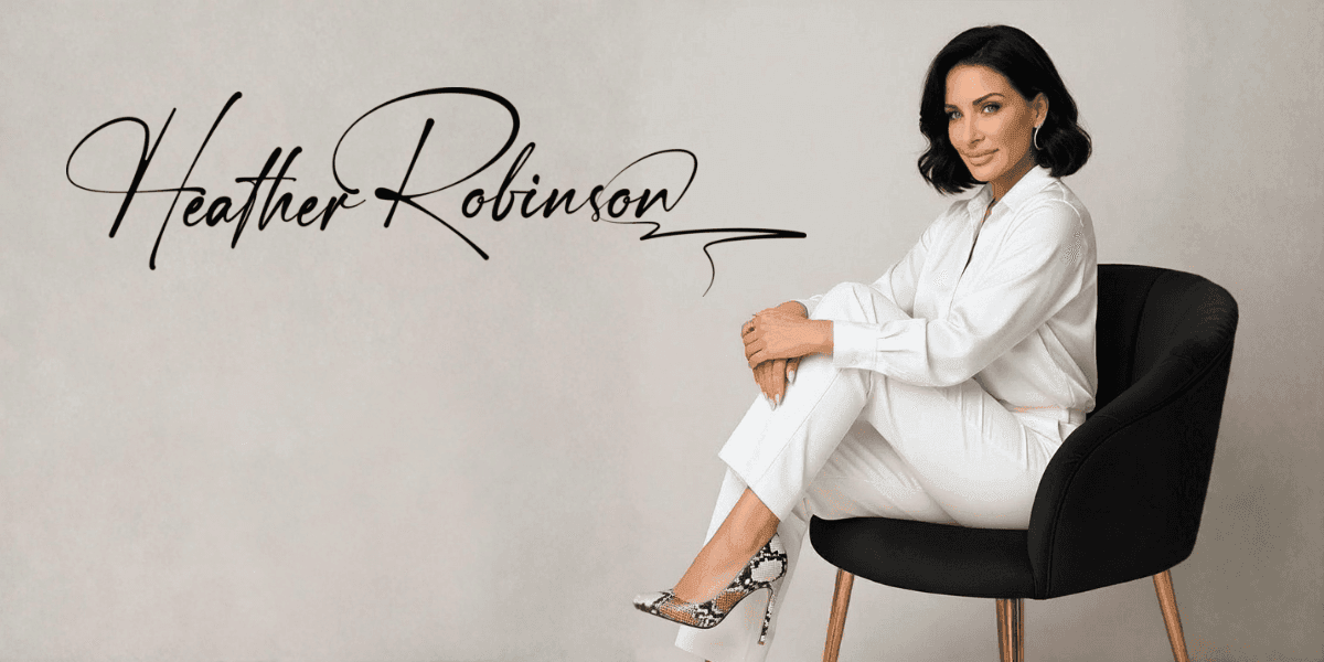 Woman in white suit sitting on black chair with “Heather Robinson” text, representing luxury commercial design brand.
