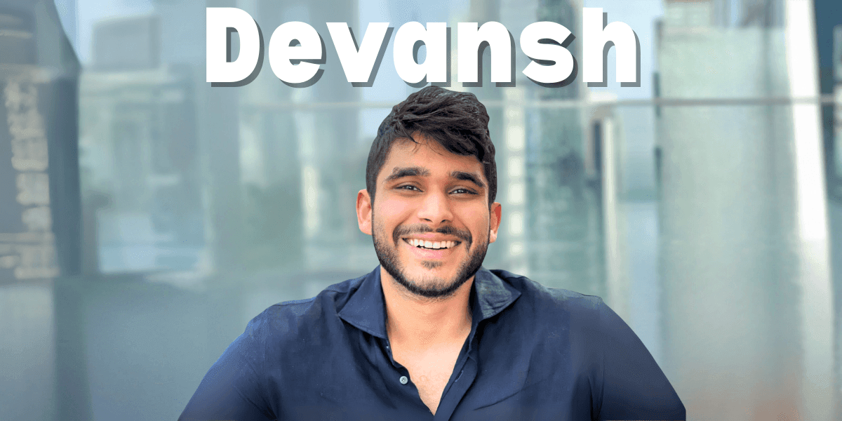 Smiling man named Devansh in dark shirt, with bold text overhead, symbolizing AI thought leadership and community impact.
