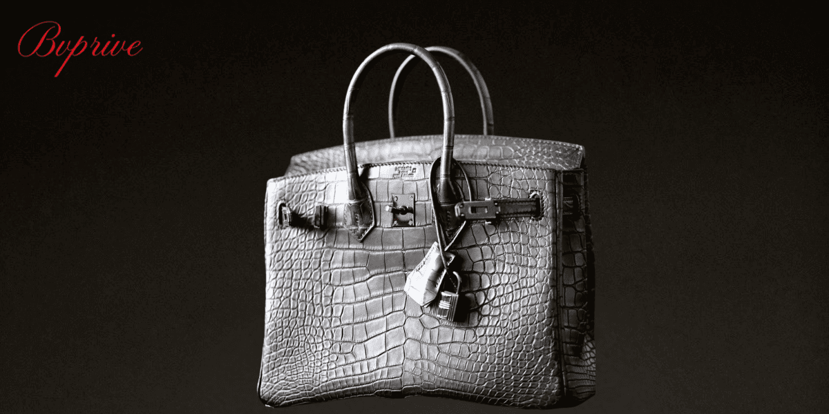 Luxury Hermes Birkin handbag made from grey crocodile leather with polished metal hardware, lock, and elegant design for a high-end fashion look.