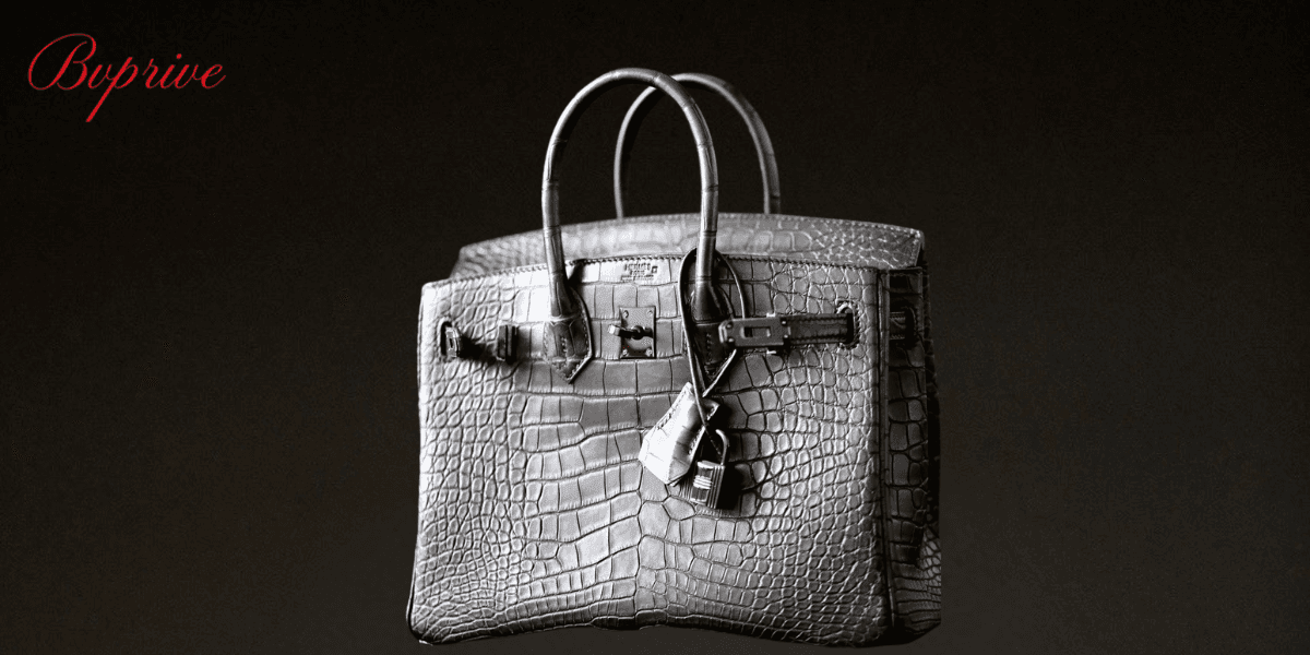 Luxury Hermes Birkin handbag made from grey crocodile leather with polished metal hardware, lock, and elegant design for a high-end fashion look.
