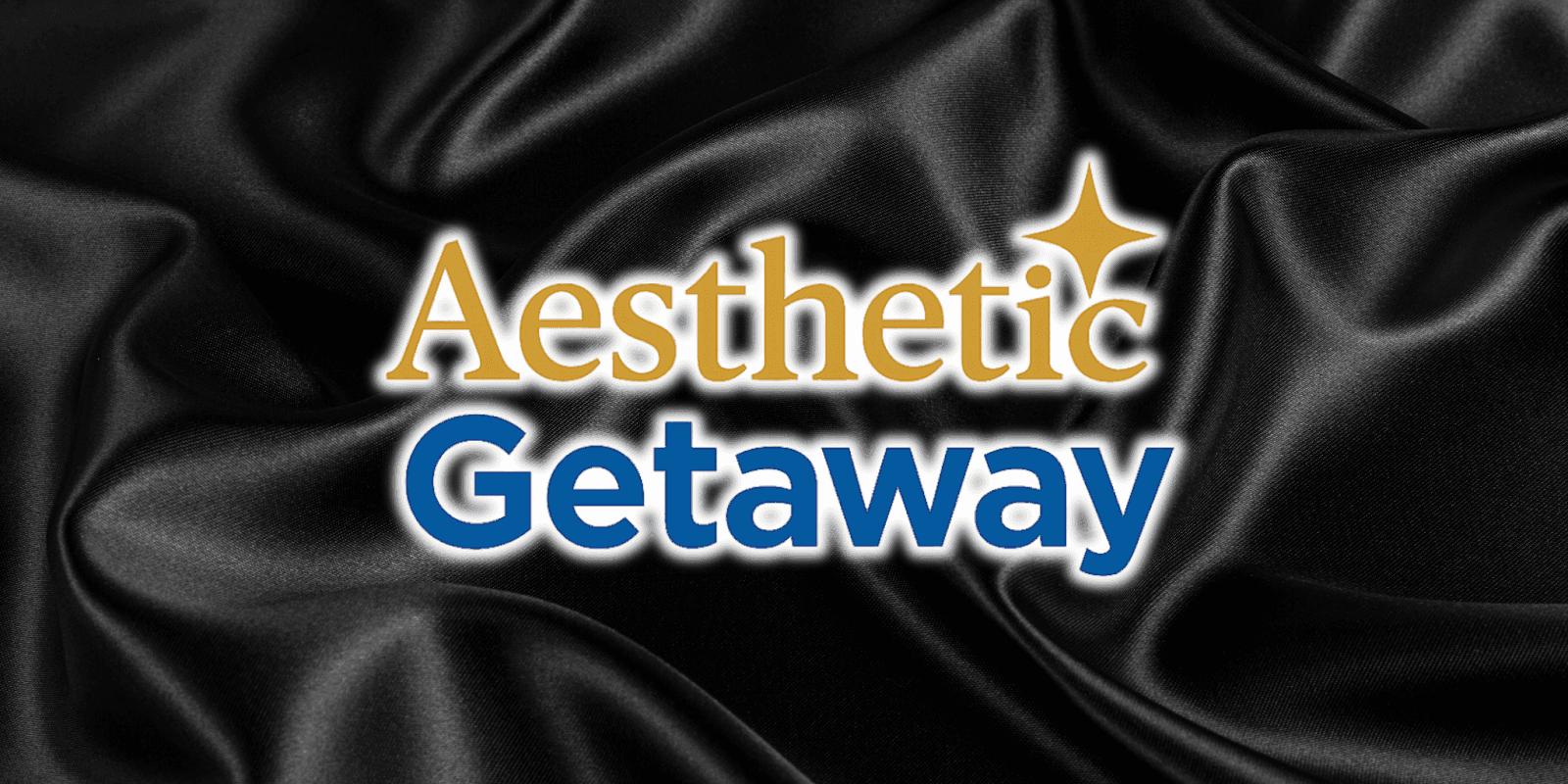 Aesthetic Getaway logo in gold and blue text on a smooth black satin background, conveying elegance and luxury.