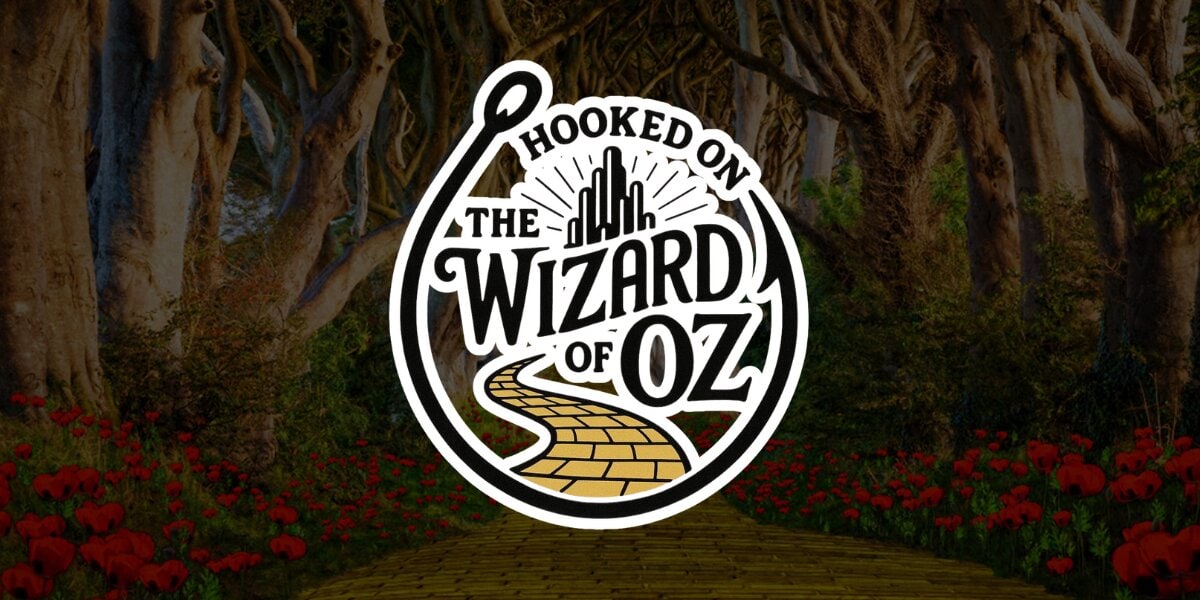 The Wizard of Oz logo with vibrant red flowers in the background, symbolizing creativity and imagination in education.
