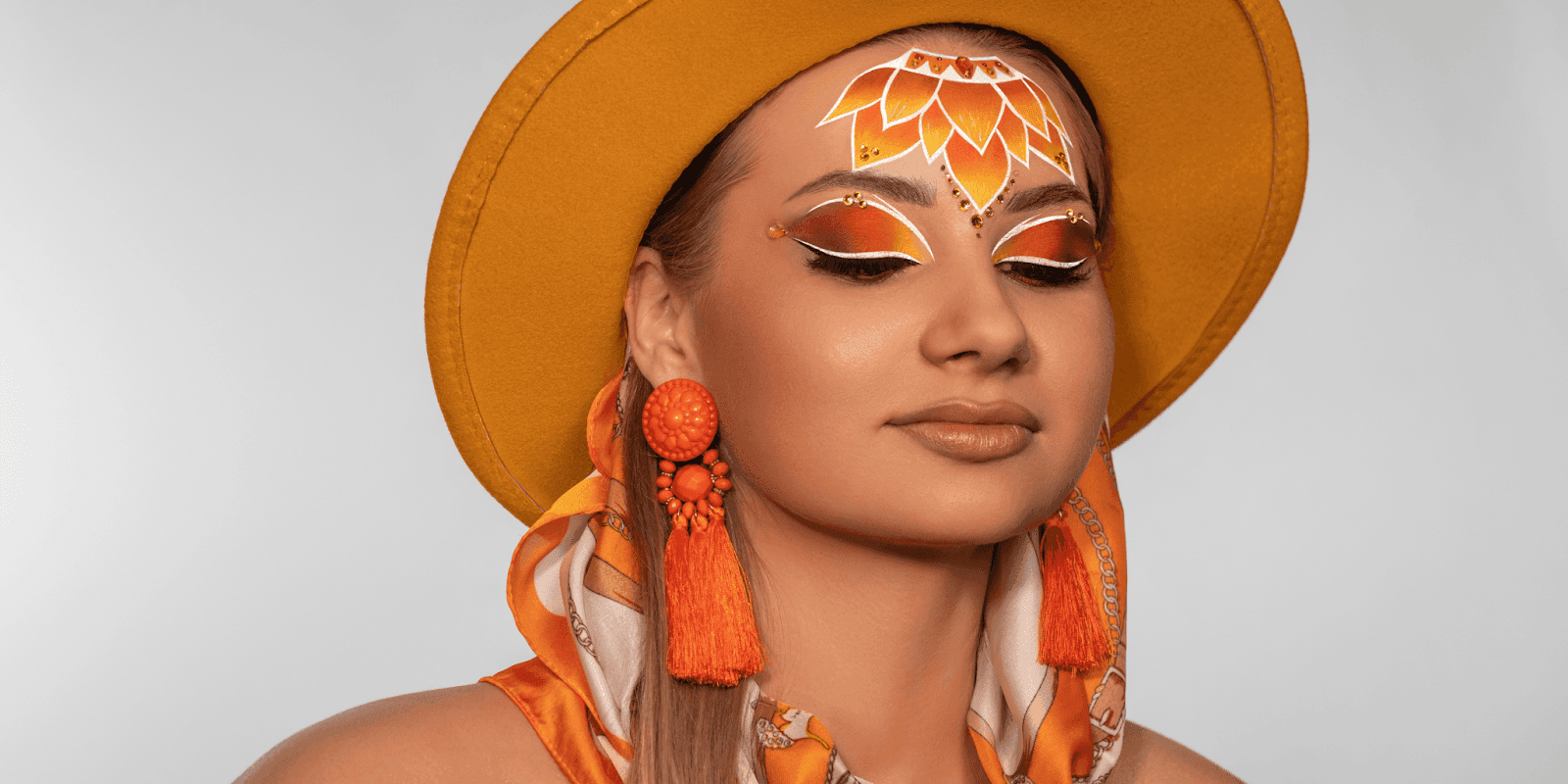 Olena Kotelnytska, a Miami-based makeup artist, combines Eastern European and Western influences, excelling at NYFW and global competitions.
