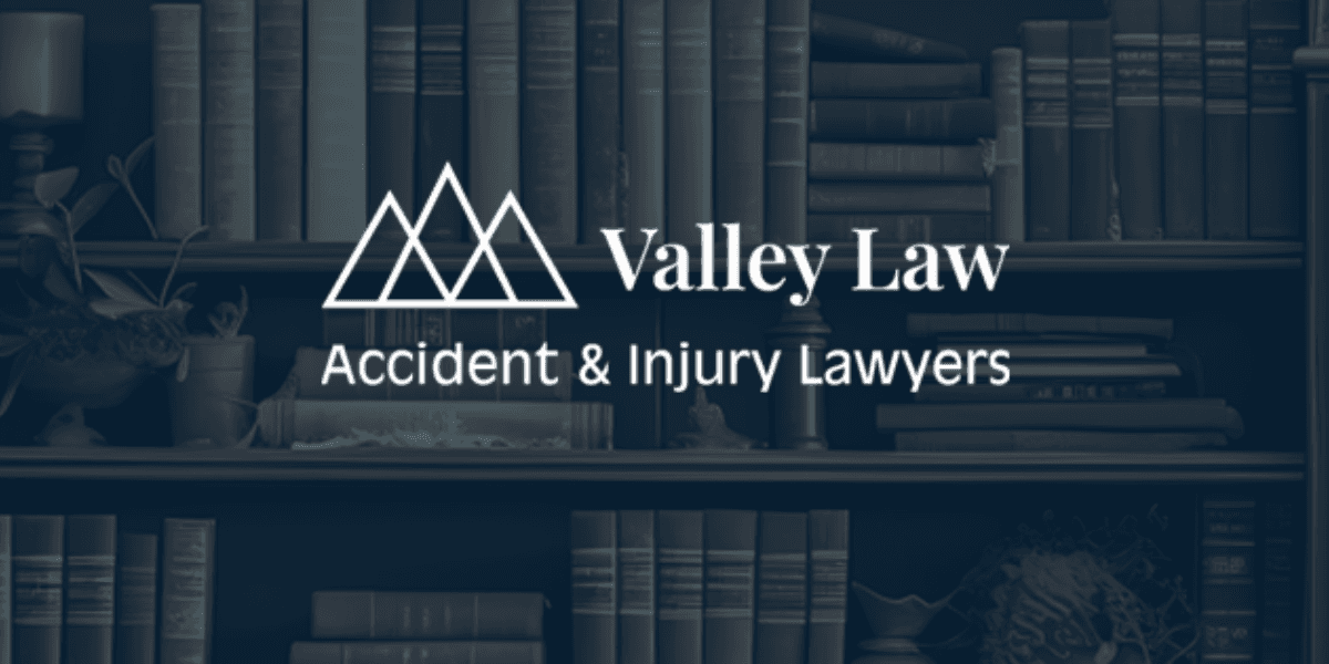 Valley Law Accident & Injury Lawyers logo over a background of bookshelves and legal-themed decor.