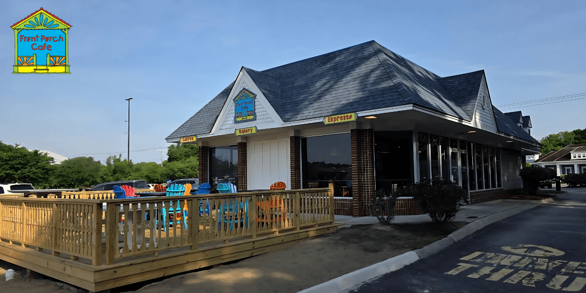 Front Porch Café building with outdoor patio seating and colorful chairs under clear blue sky.