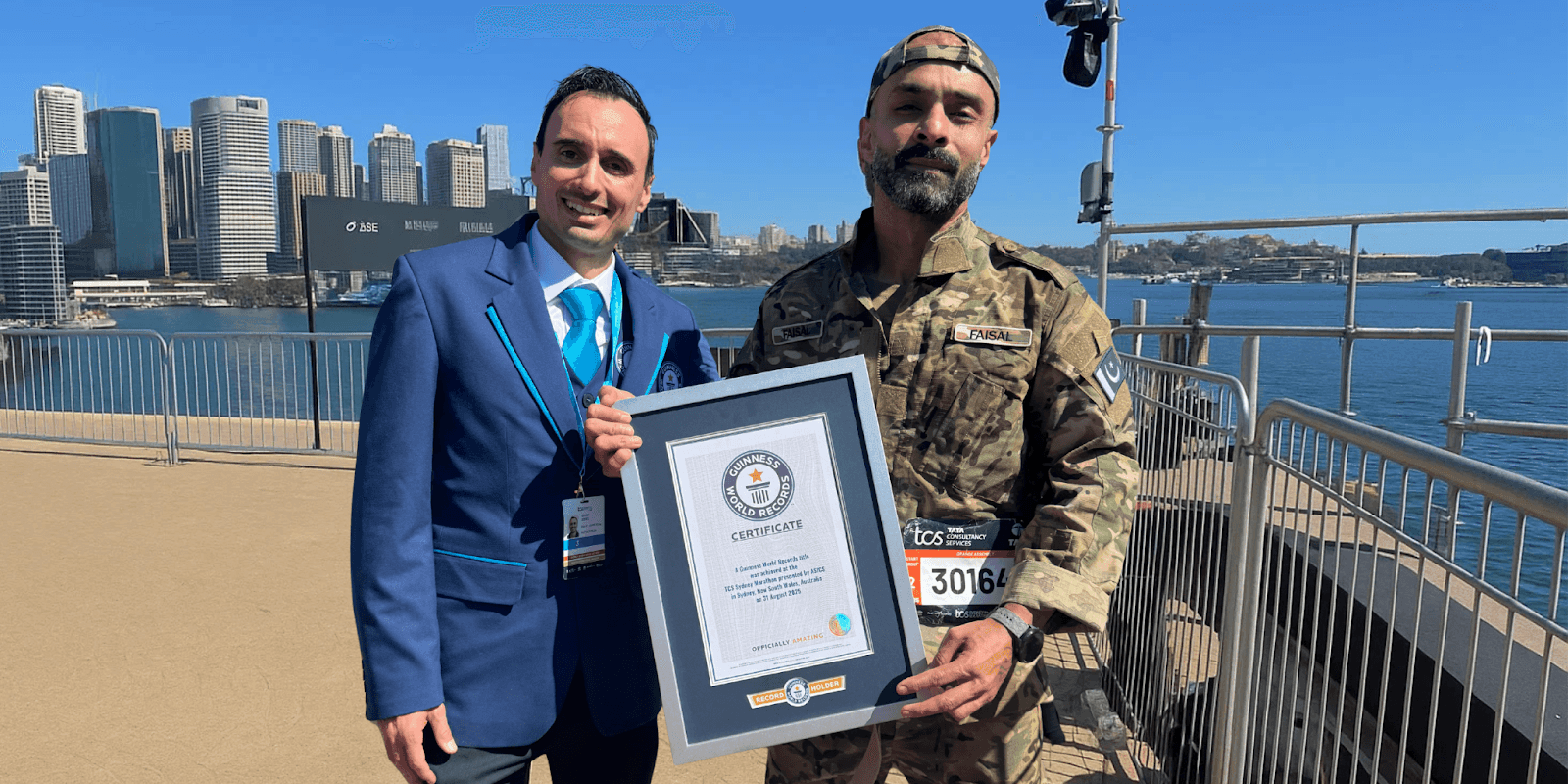 Faisal Shafi receiving Guinness World Record for fastest marathon in military suit in Sydney.