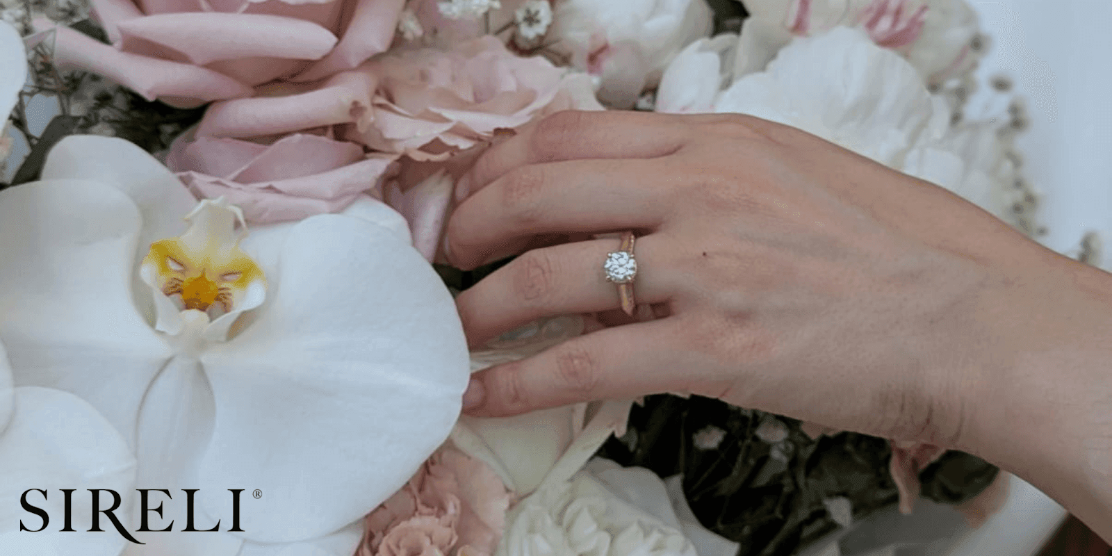 SIRELI jewellery showcasing a handcrafted engagement ring with a delicate diamond on a hand, symbolizing luxury, craftsmanship, and personalized design