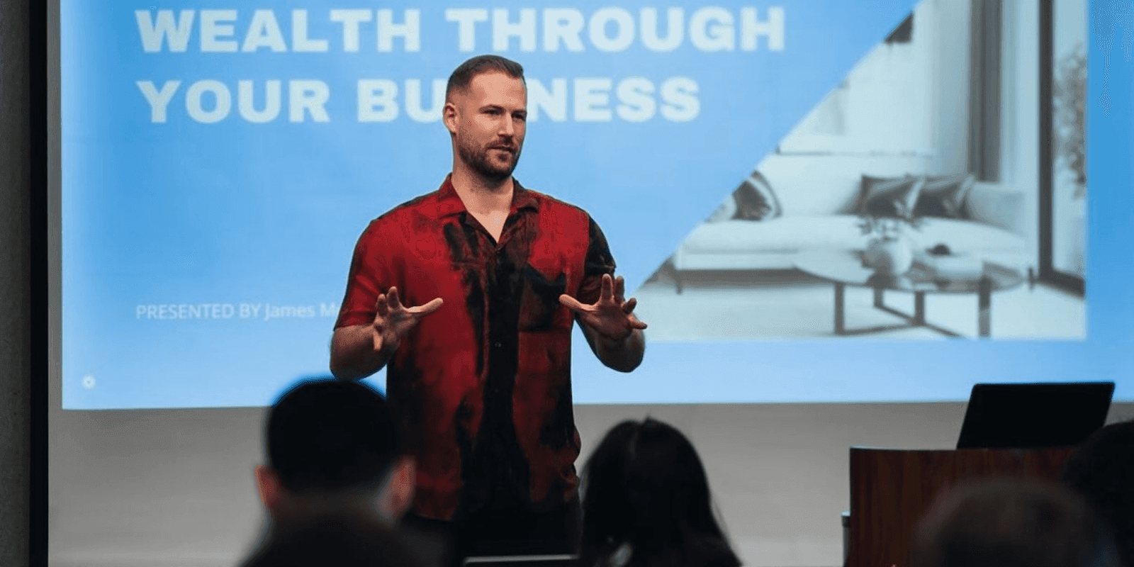 James Z Murphy presenting strategies for scaling profitable Airbnb businesses at a seminar.