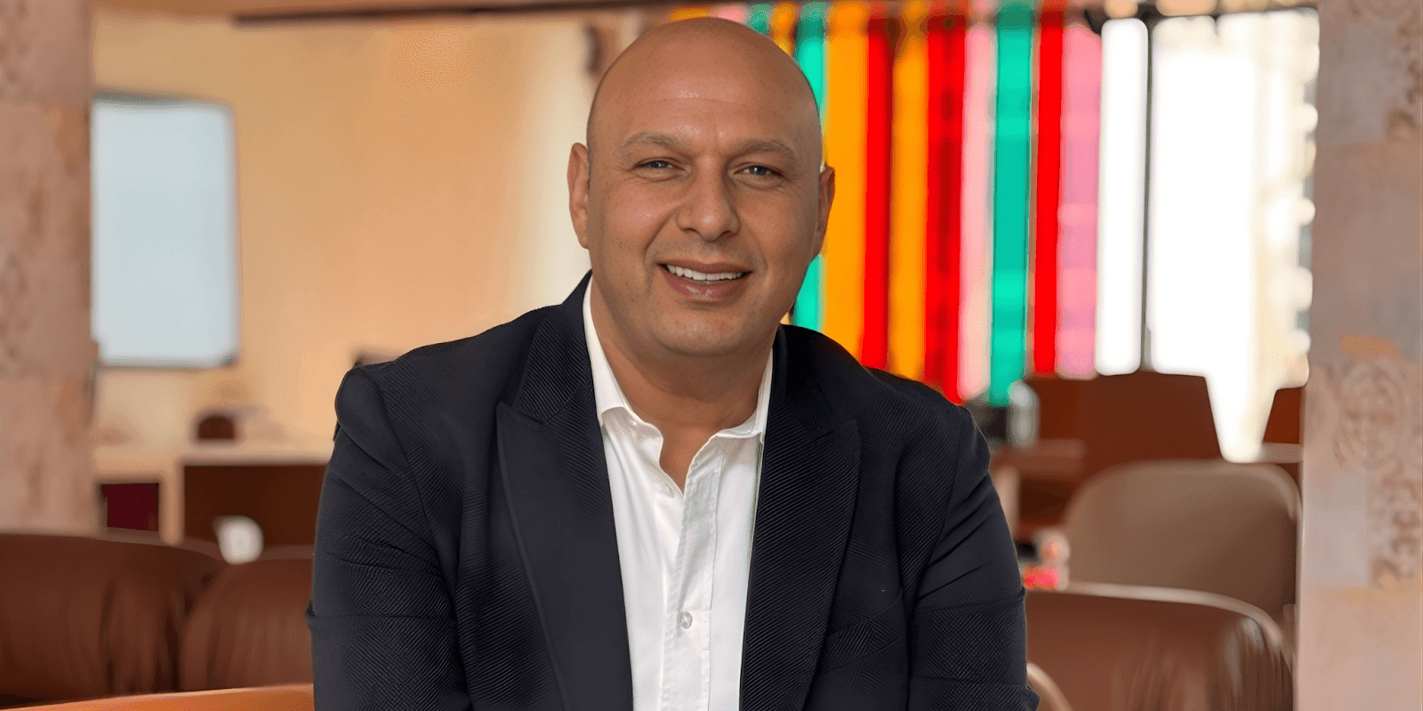 "Tarek El Masry, COO of ALDAU Development, a leader in Egypt's luxury hospitality industry, with a professional demeanor."