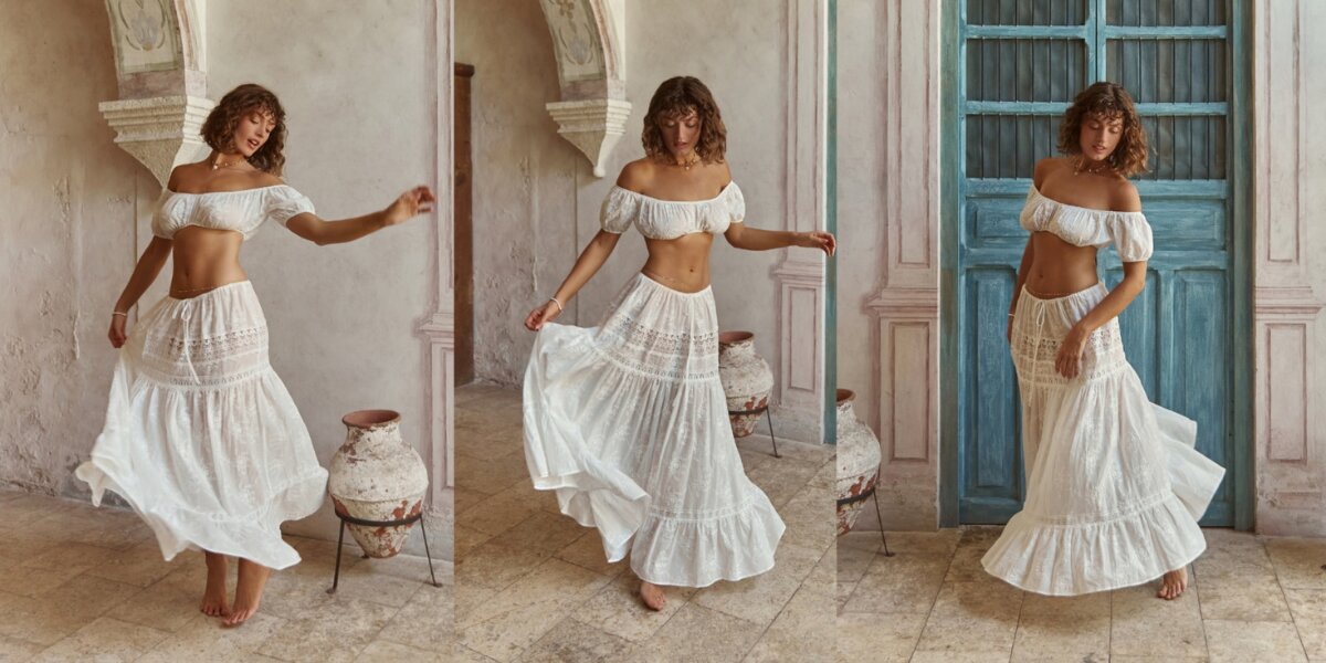 Model styling a white adjustable cotton matching set in a Mediterranean-inspired courtyard.