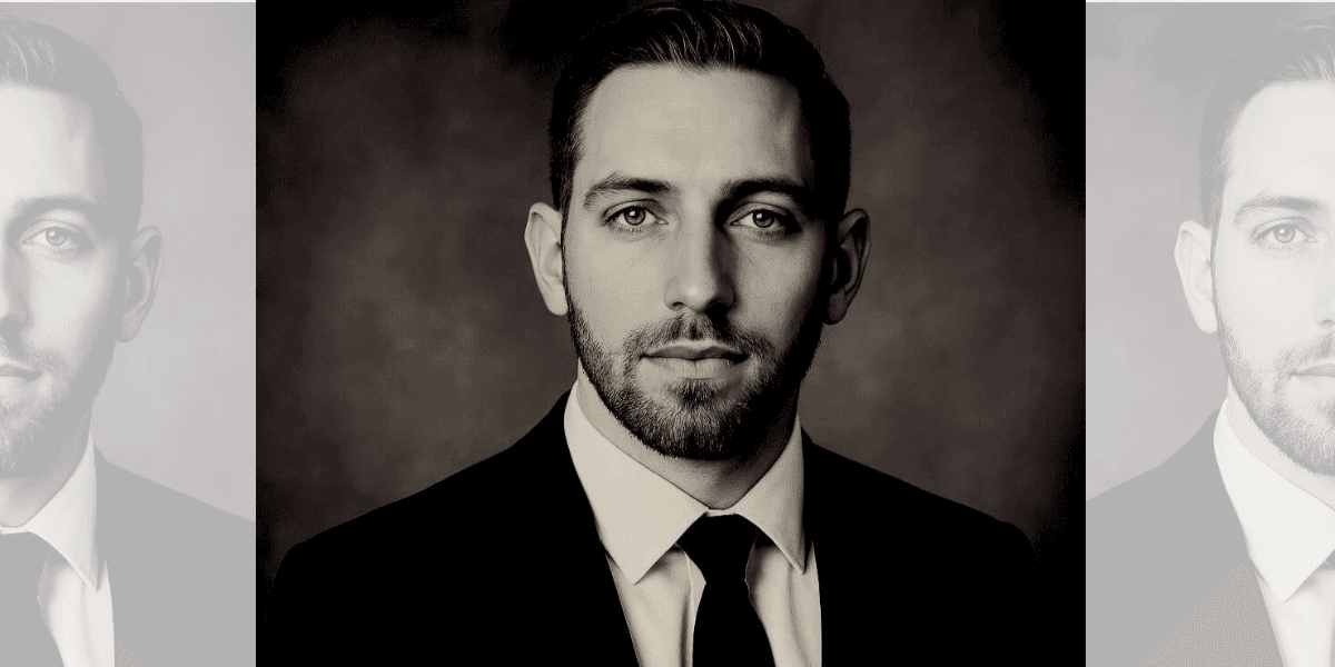 Austin Serb, founder of Serbyte Development, dressed in a suit, focusing on AI-driven business growth and web solutions.