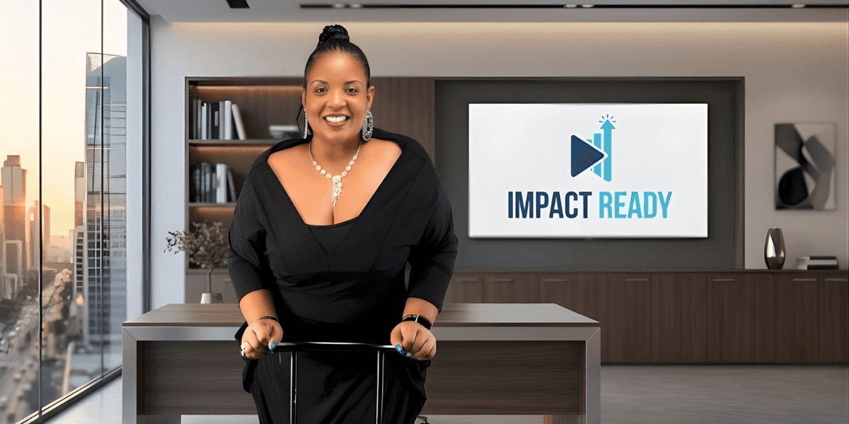 Twyla Garrett, in a black dress, stands before a large screen, unveiling IMPACT Ready's partnership with Verizon for small businesses.