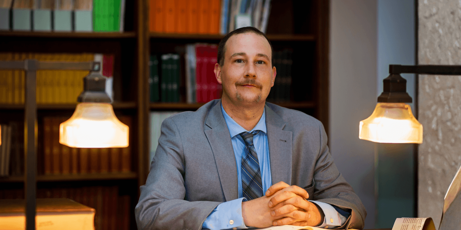 Wm. Marcus Wilkerson, a Southeast Texas attorney, sitting confidently in a professional setting, exemplifying expertise and dedication.