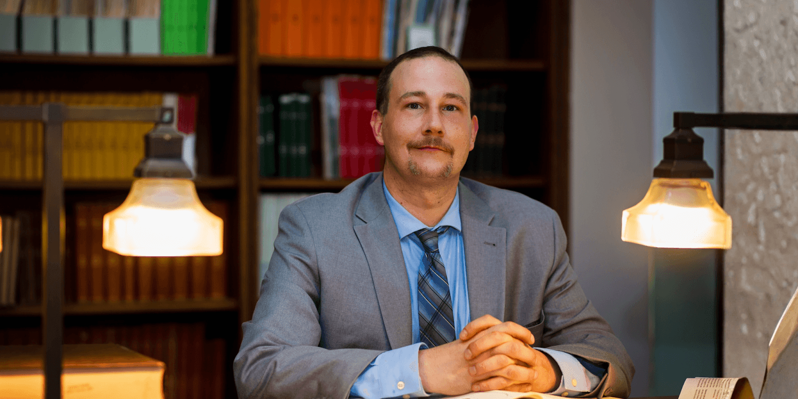 Wm. Marcus Wilkerson, a Southeast Texas attorney, sitting confidently in a professional setting, exemplifying expertise and dedication.
