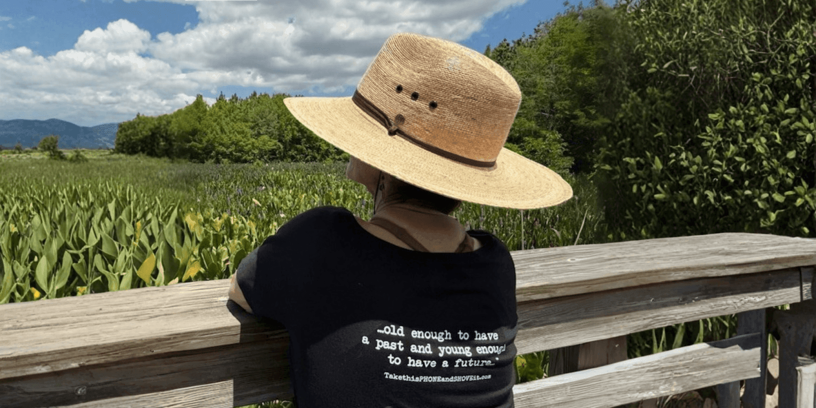 Anne Goldberg, wearing a straw hat, gazes at the landscape, embodying her mantra: 'Old enough to have a past.