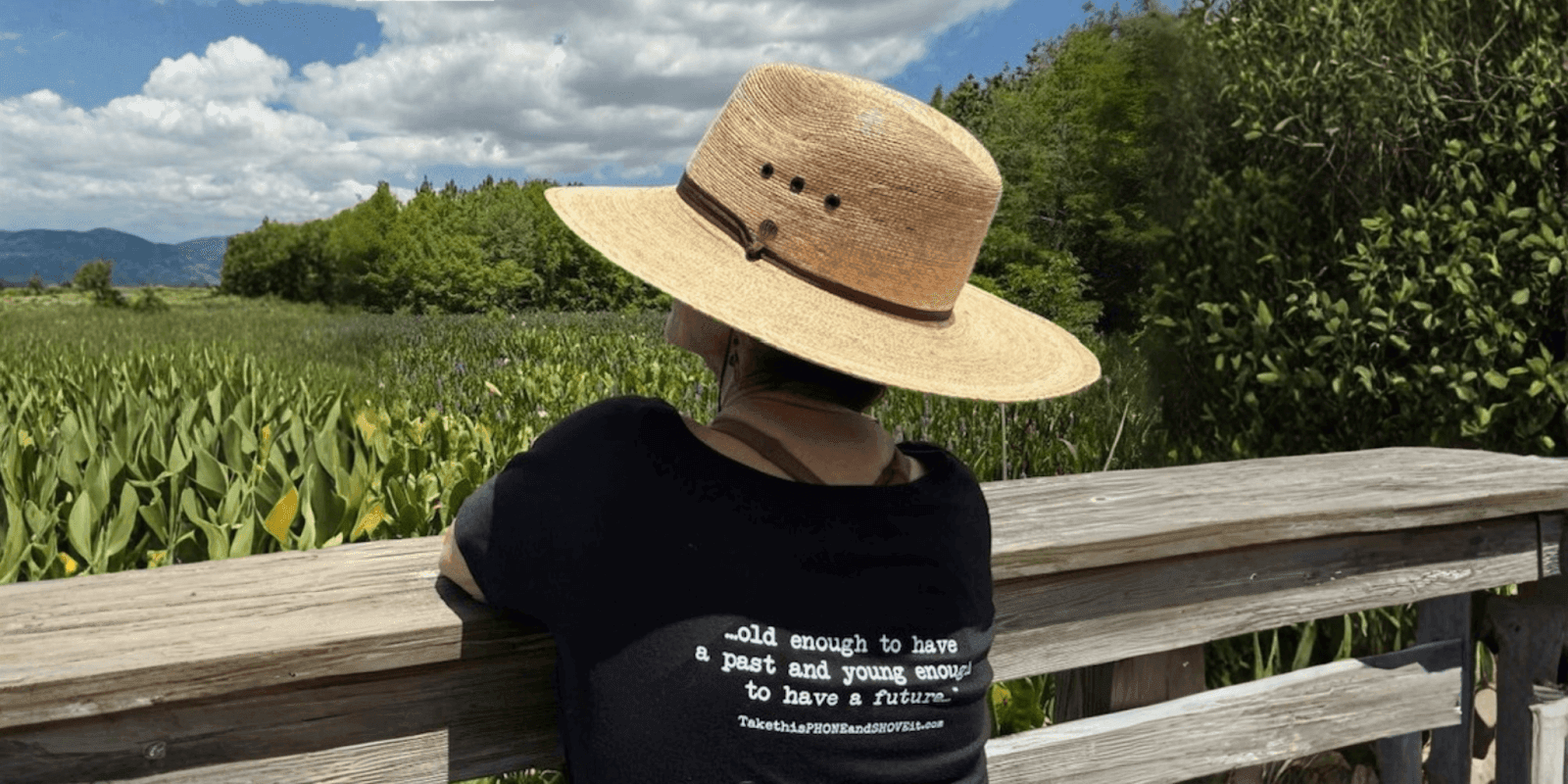 Anne Goldberg, wearing a straw hat, gazes at the landscape, embodying her mantra: 'Old enough to have a past.